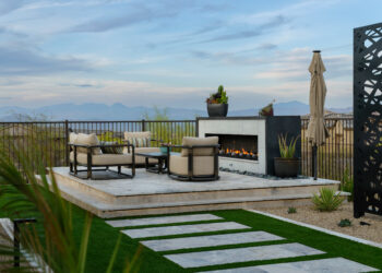Raised deck with chairs, trellis, and firepit